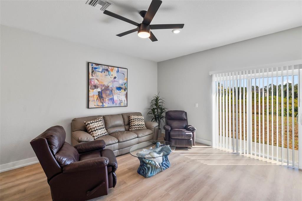 9155 Agate Street Port Charlotte, FL 33981 - Photo 26 of 30 a living room with furniture and a window