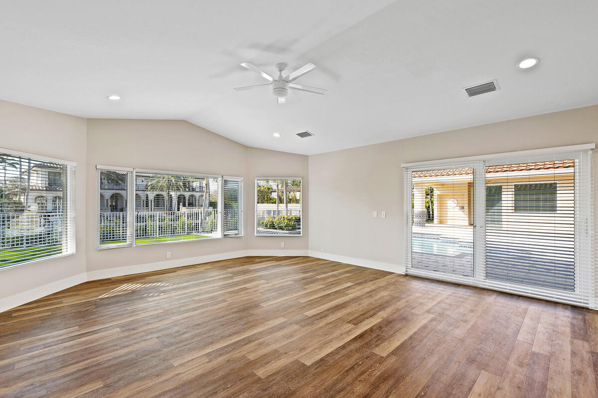 533 East Alexander Palm Road Boca Raton, FL 33432 - Photo 28 of 44 a view of empty room with wooden floor and fan