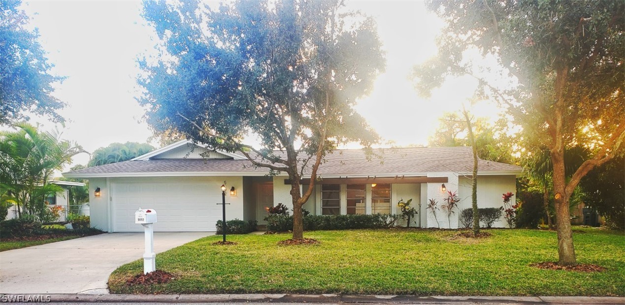 front view of a house with a yard