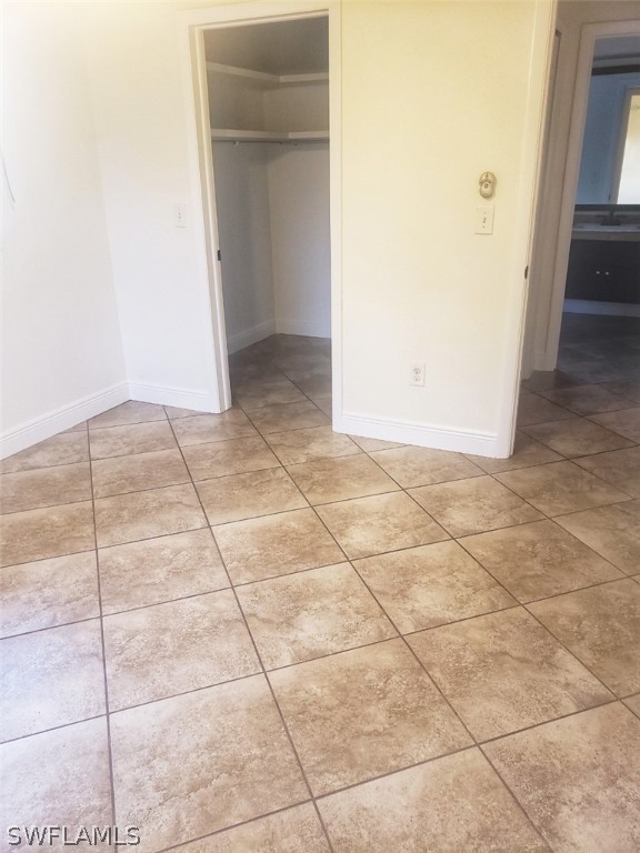 5692 Eichen Circle Fort Myers, FL 33919 - Photo 21 of 33 wooden floor in a hallway with a shower