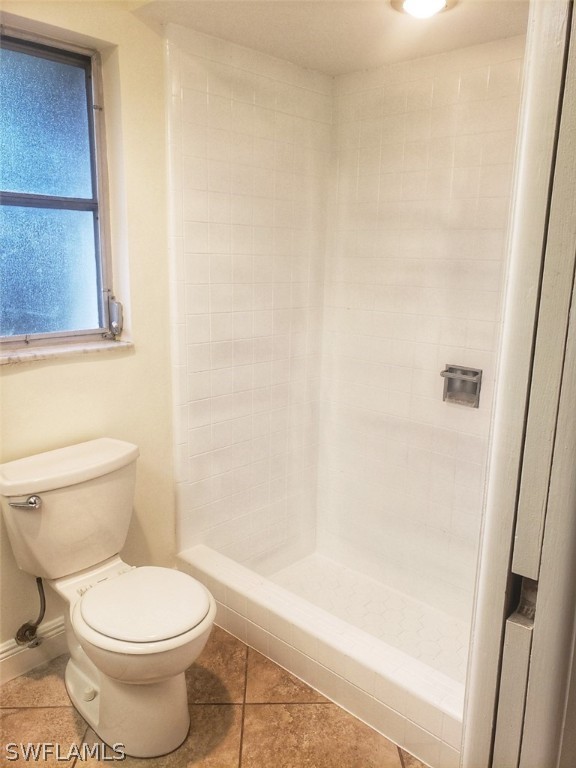 5692 Eichen Circle Fort Myers, FL 33919 - Photo 24 of 33 a bathroom with a toilet and a shower