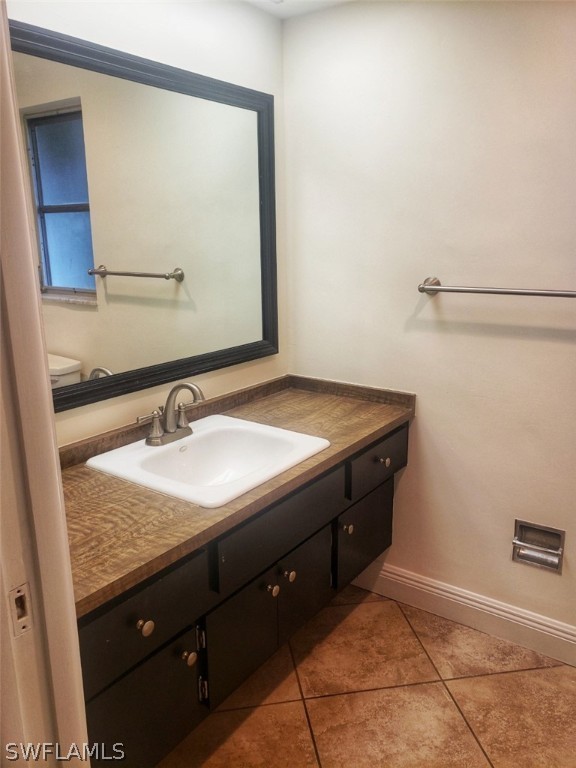 5692 Eichen Circle Fort Myers, FL 33919 - Photo 26 of 33 a bathroom with a granite countertop sink and a mirror