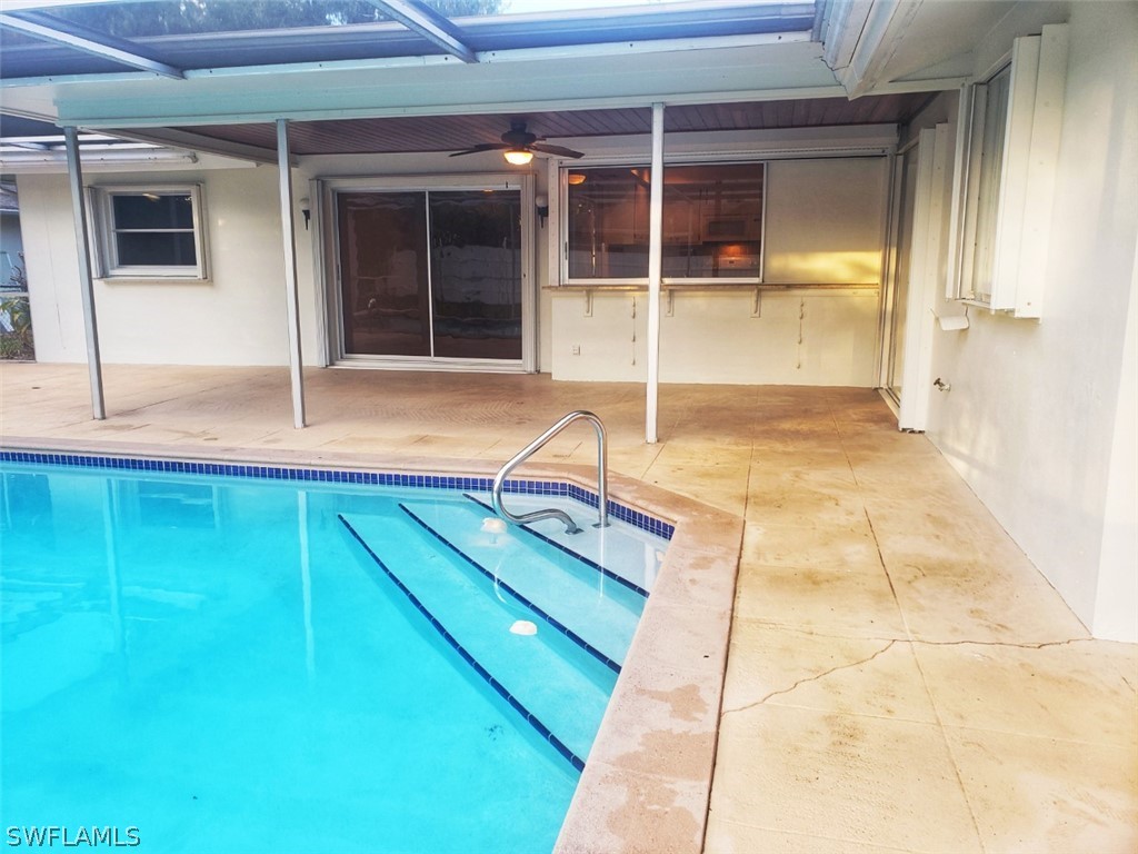 5692 Eichen Circle Fort Myers, FL 33919 - Photo 30 of 33 a backyard of a house with table and chairs