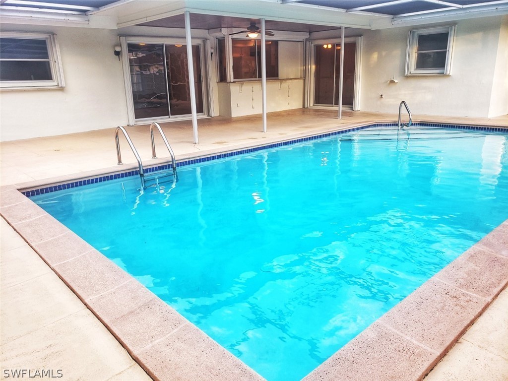5692 Eichen Circle Fort Myers, FL 33919 - Photo 31 of 33 a swimming pool with outdoor seating