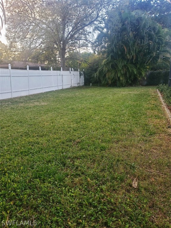 5692 Eichen Circle Fort Myers, FL 33919 - Photo 32 of 33 a view of a yard with a trees
