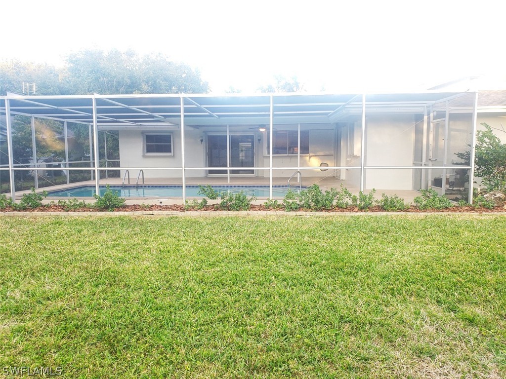 5692 Eichen Circle Fort Myers, FL 33919 - Photo 33 of 33 a view of house in front of a big yard with large trees