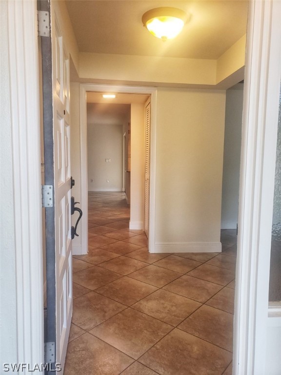 5692 Eichen Circle Fort Myers, FL 33919 - Photo 4 of 33 a view of a hallway with wooden shelves
