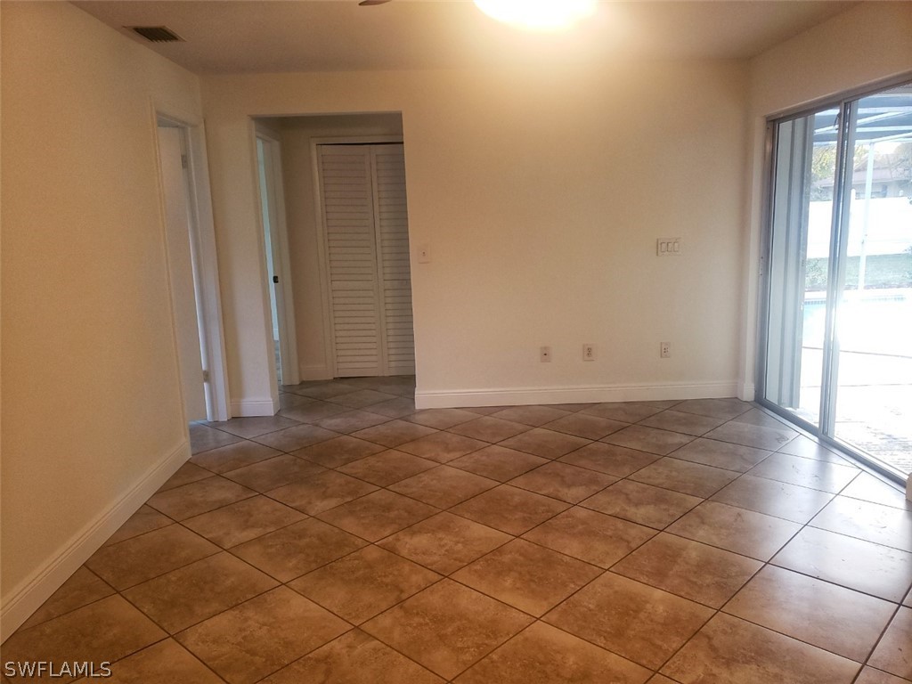 5692 Eichen Circle Fort Myers, FL 33919 - Photo 9 of 33 an empty room with a empty space and a window