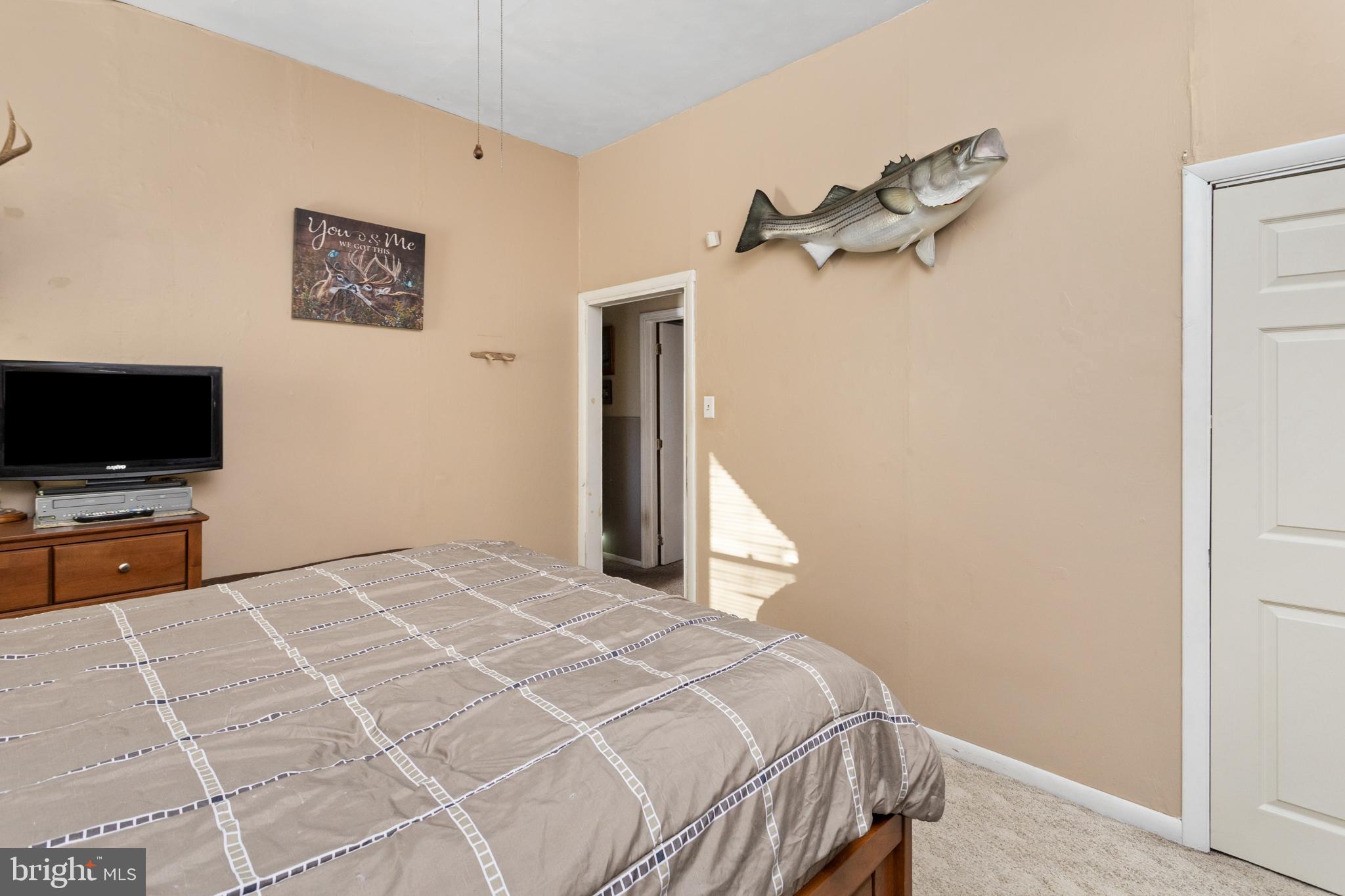 450 Stokes Road Shamong, NJ 08088 - Photo 16 of 35 a bedroom with a bed and a flat screen tv