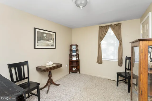 a view of room with workspace and windows