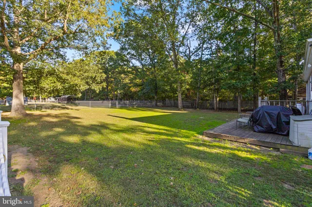 a view of a playground with basketball court