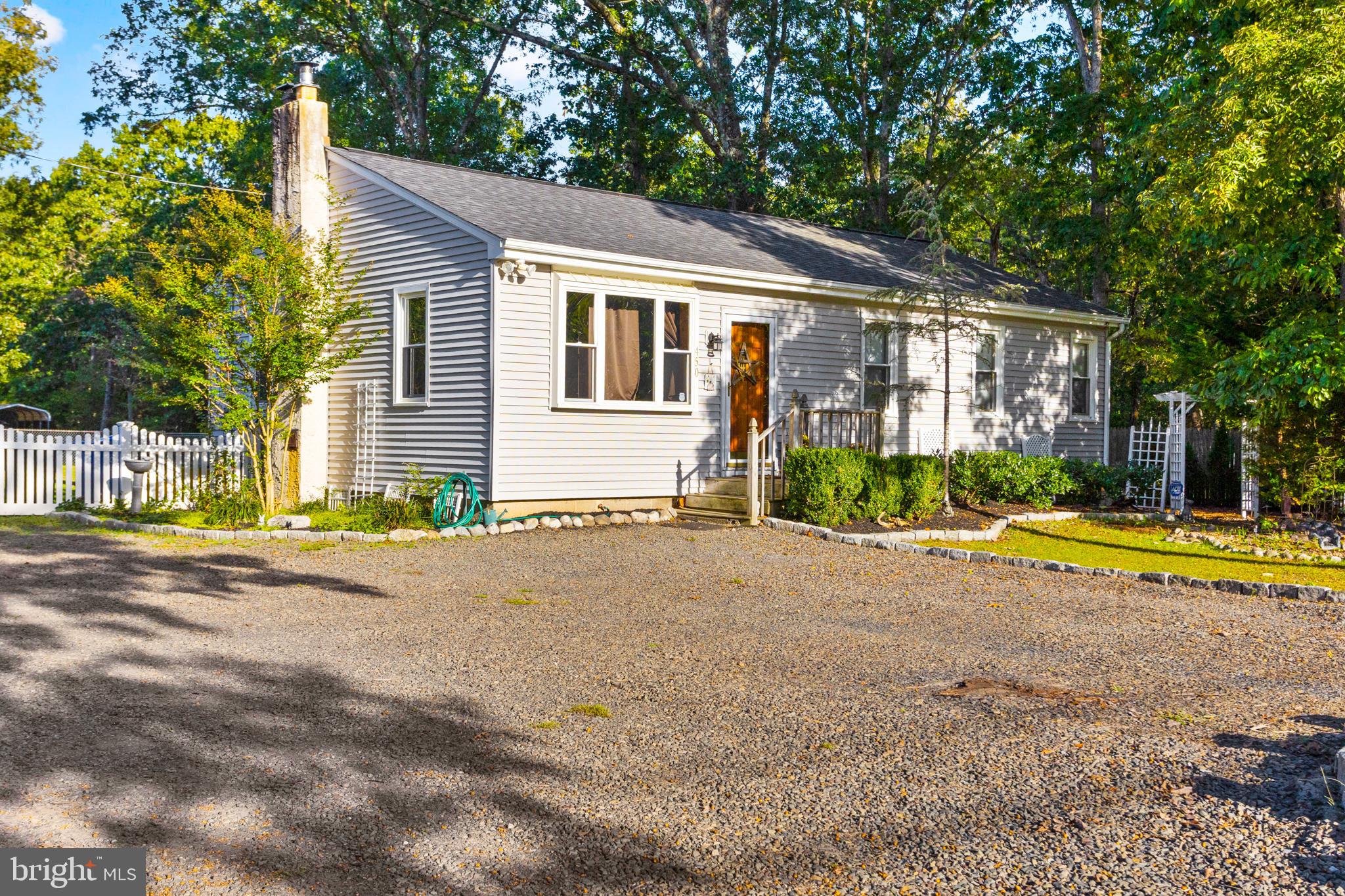 450 Stokes Road Shamong, NJ 08088 - Photo 3 of 35 a view of a house with swimming pool and a yard