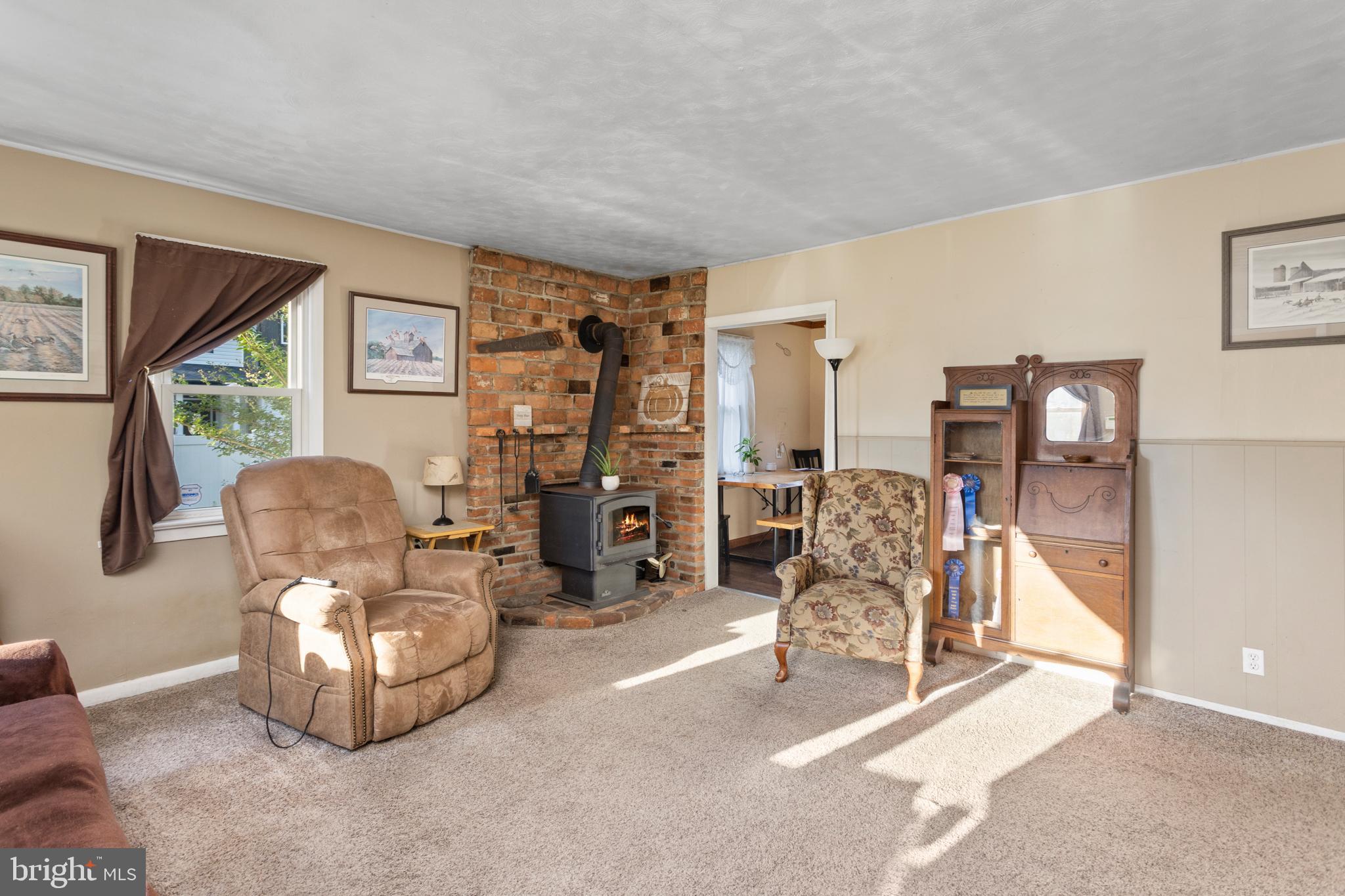450 Stokes Road Shamong, NJ 08088 - Photo 5 of 35 a living room with furniture gym equipment and a large window
