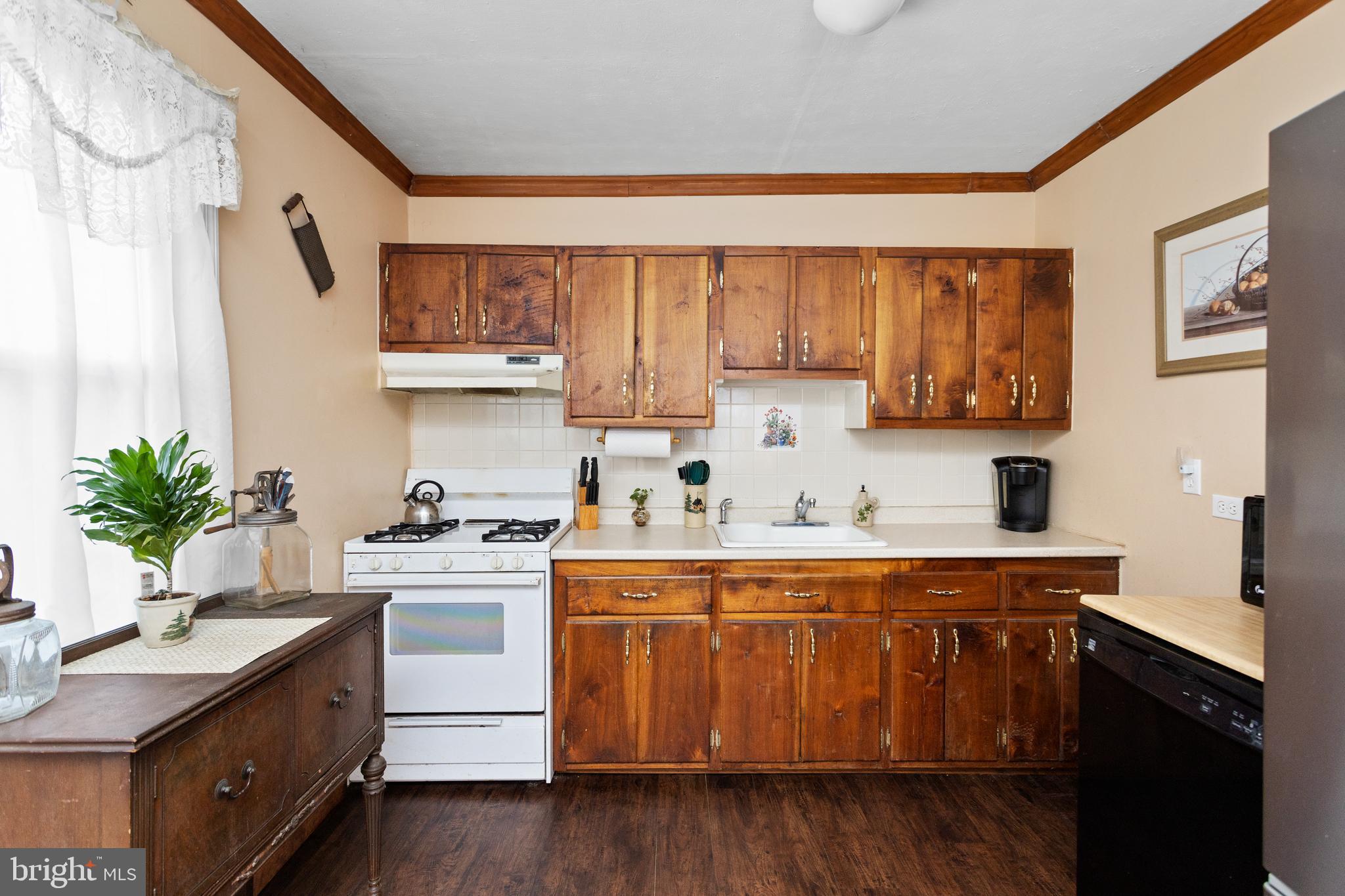 450 Stokes Road Shamong, NJ 08088 - Photo 7 of 35 a kitchen with a sink a stove and cabinets