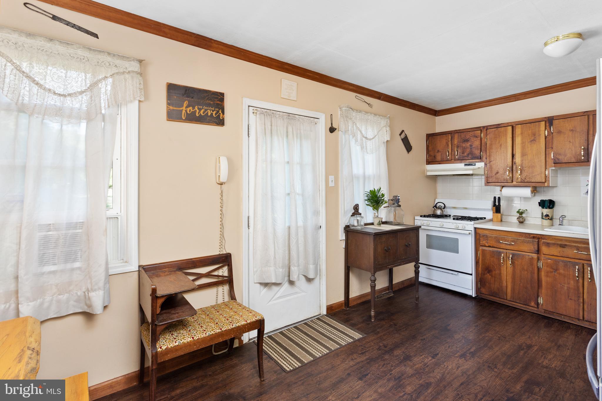 450 Stokes Road Shamong, NJ 08088 - Photo 9 of 35 a kitchen with white cabinets and white appliances