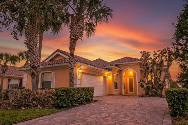 front view of a house with a garden