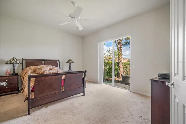a view of a bedroom with bed and balcony