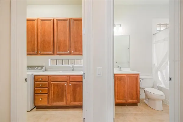 a view of a room with a table and chairs