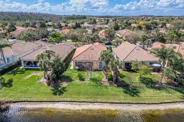 a front view of a house with a garden and a yard
