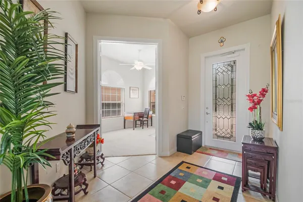 a living room with furniture and flowers