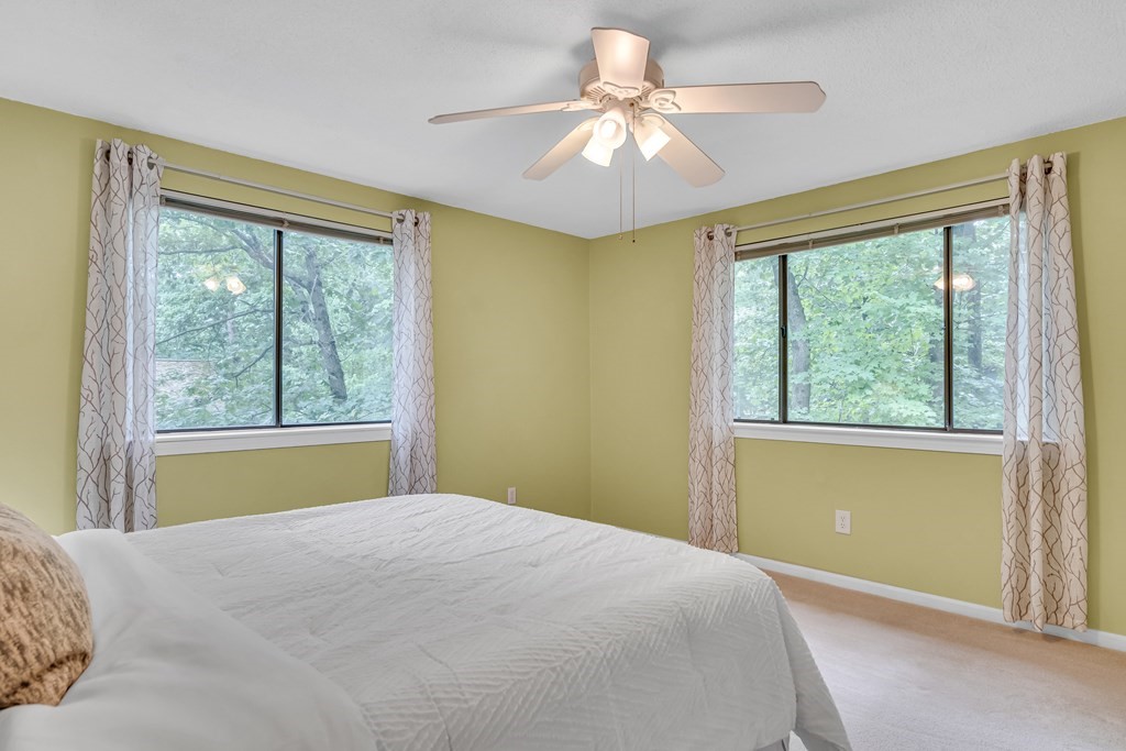 32 Mountain Gate Road, Unit 32 Ashland, MA 01721 - Photo 18 of 24 a bedroom with a large bed and a large window