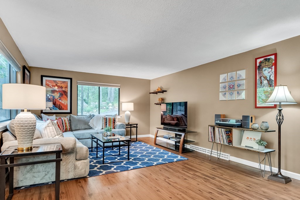 32 Mountain Gate Road, Unit 32 Ashland, MA 01721 - Photo 8 of 24 a living room with furniture and a wooden floor