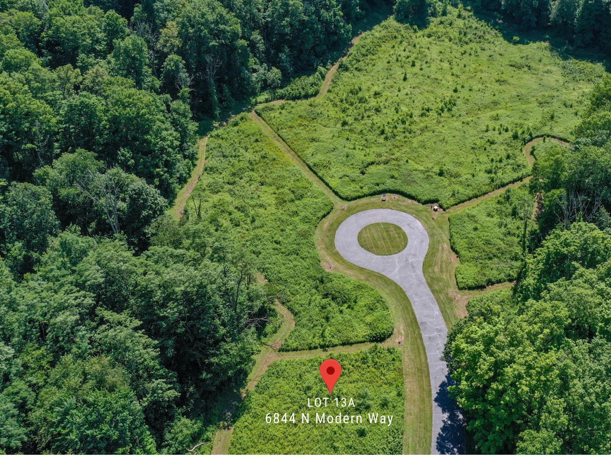 6844 North Modern Way La Porte, IN 46350 - Photo 11 of 17 a picture of a yard with plants and large trees