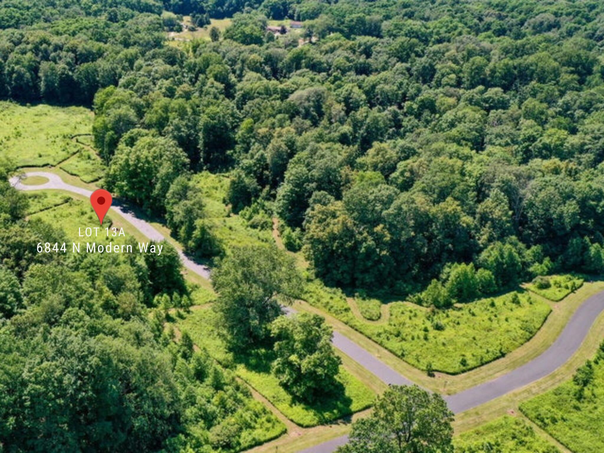 6844 North Modern Way La Porte, IN 46350 - Photo 12 of 17 a view of a garden with a tree
