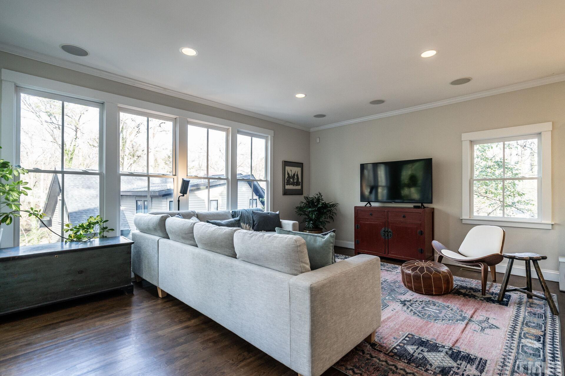 2802 Wayland Drive Raleigh, NC 27608 - Photo 10 of 37 a living room with furniture and a large window