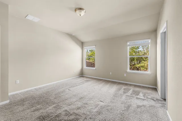 an empty room with windows