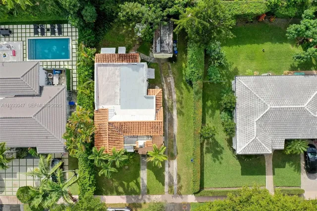 a house with swimming pool in front of it