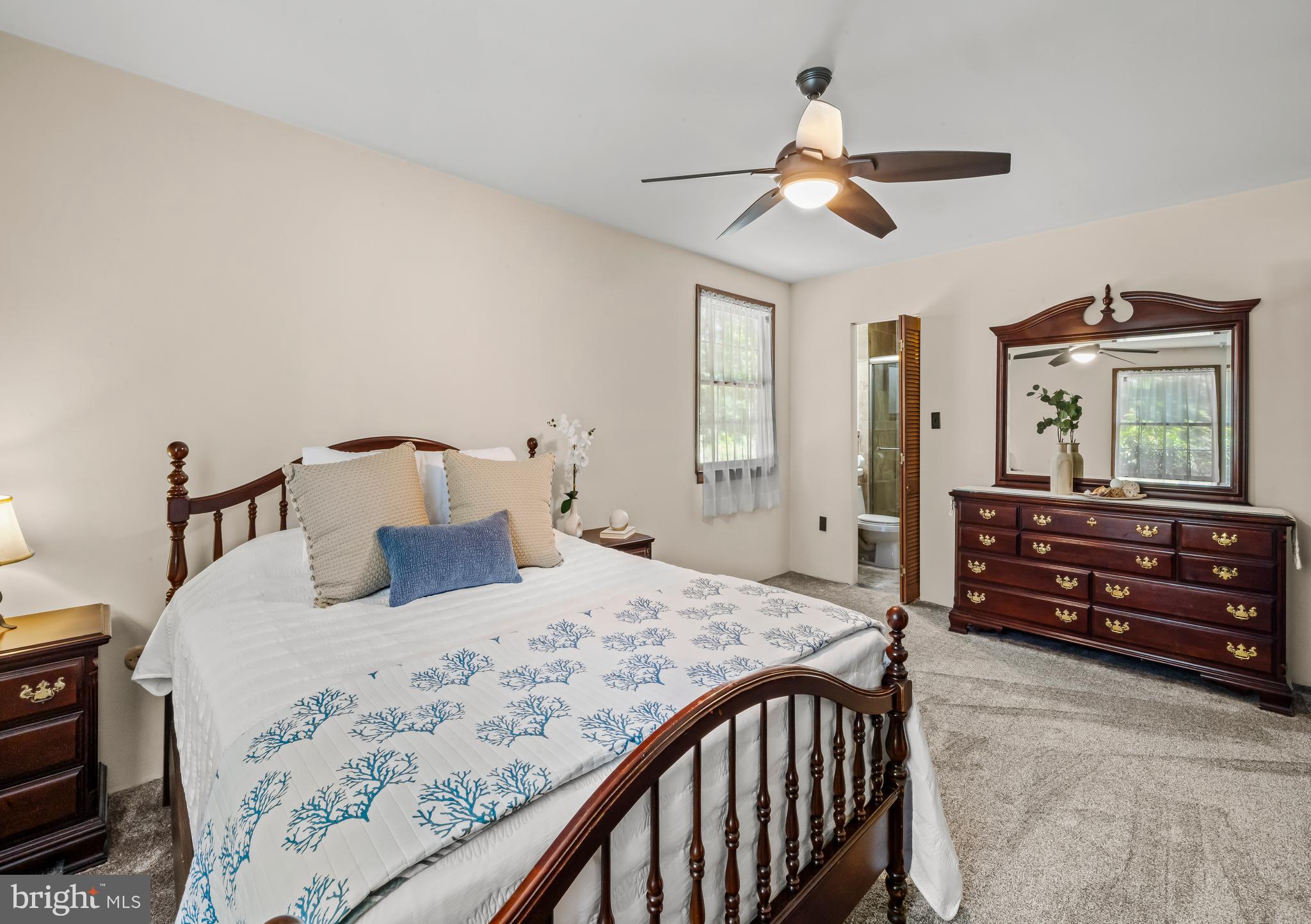 19 Miller Drive Sewell, NJ 08080 - Photo 15 of 20 a bedroom with a bed and a chandelier