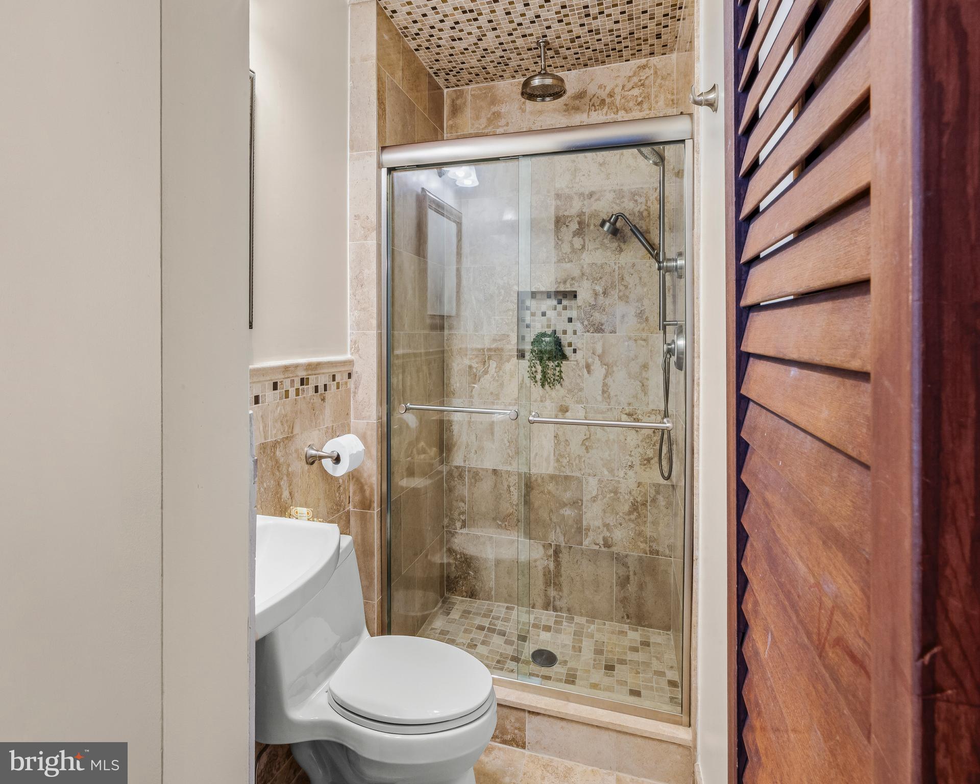 19 Miller Drive Sewell, NJ 08080 - Photo 16 of 20 a bathroom with a shower a toilet and a sink