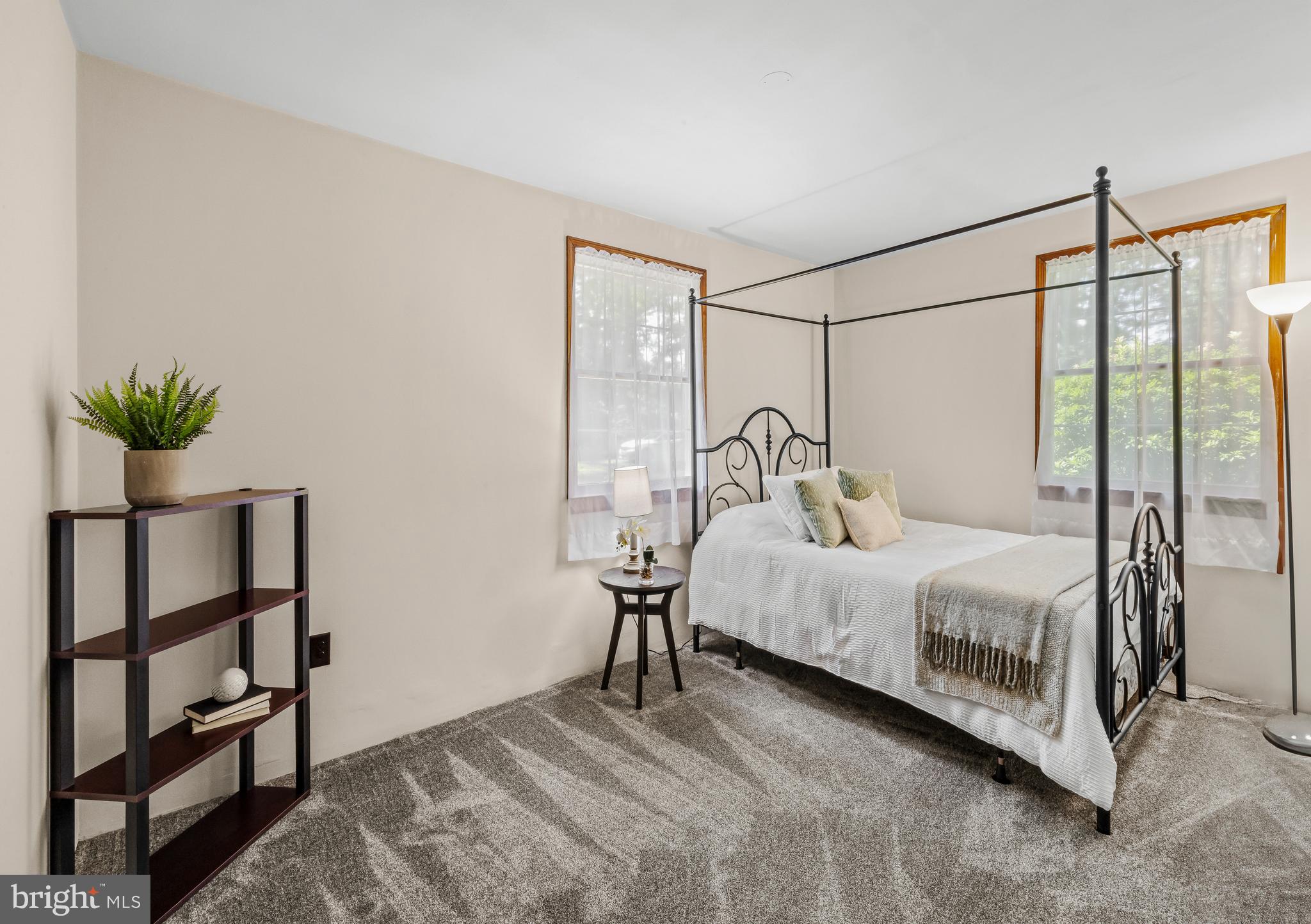 19 Miller Drive Sewell, NJ 08080 - Photo 17 of 20 a bedroom with a bed and a potted plant