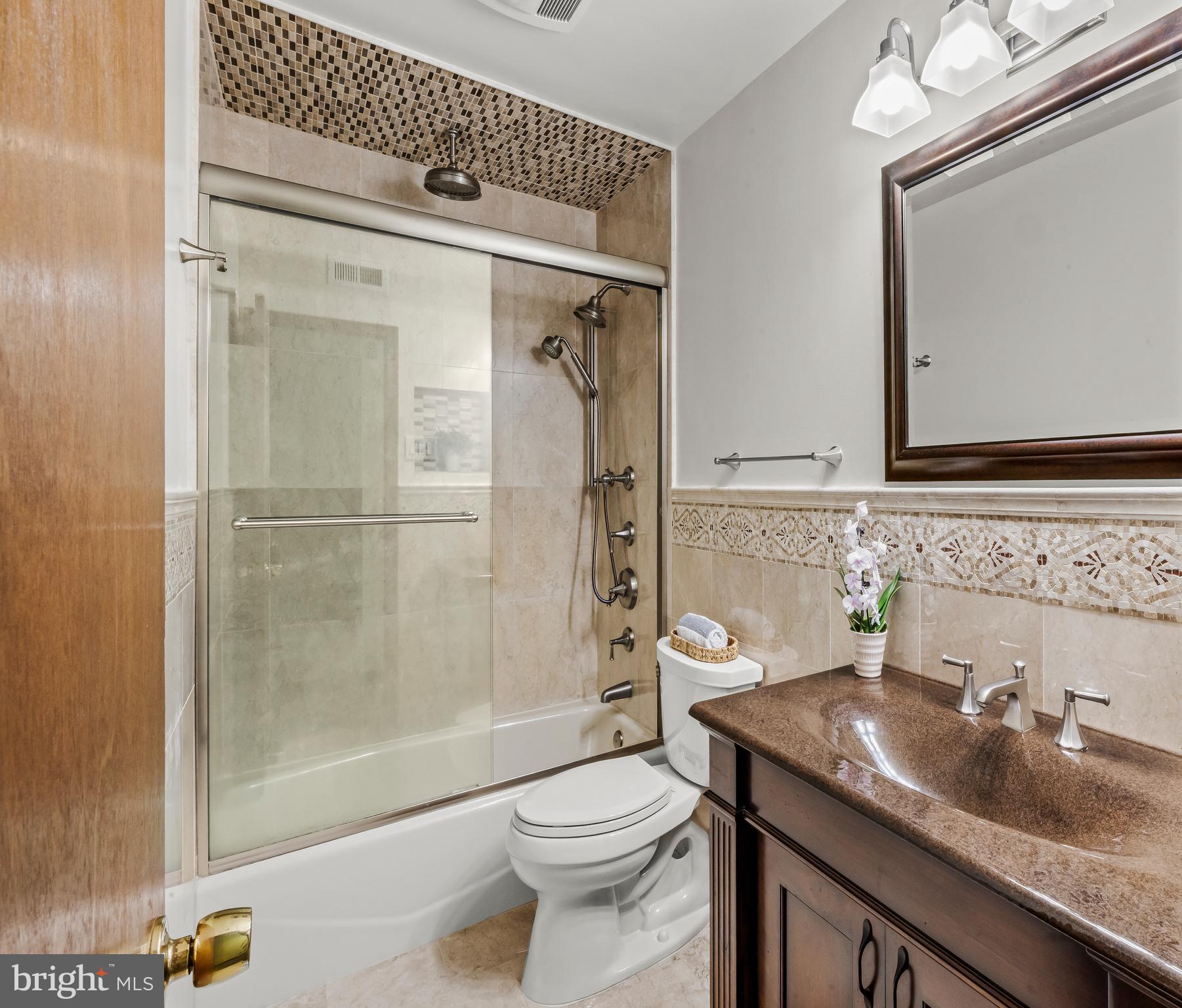 19 Miller Drive Sewell, NJ 08080 - Photo 18 of 20 a bathroom with a granite countertop sink toilet and shower