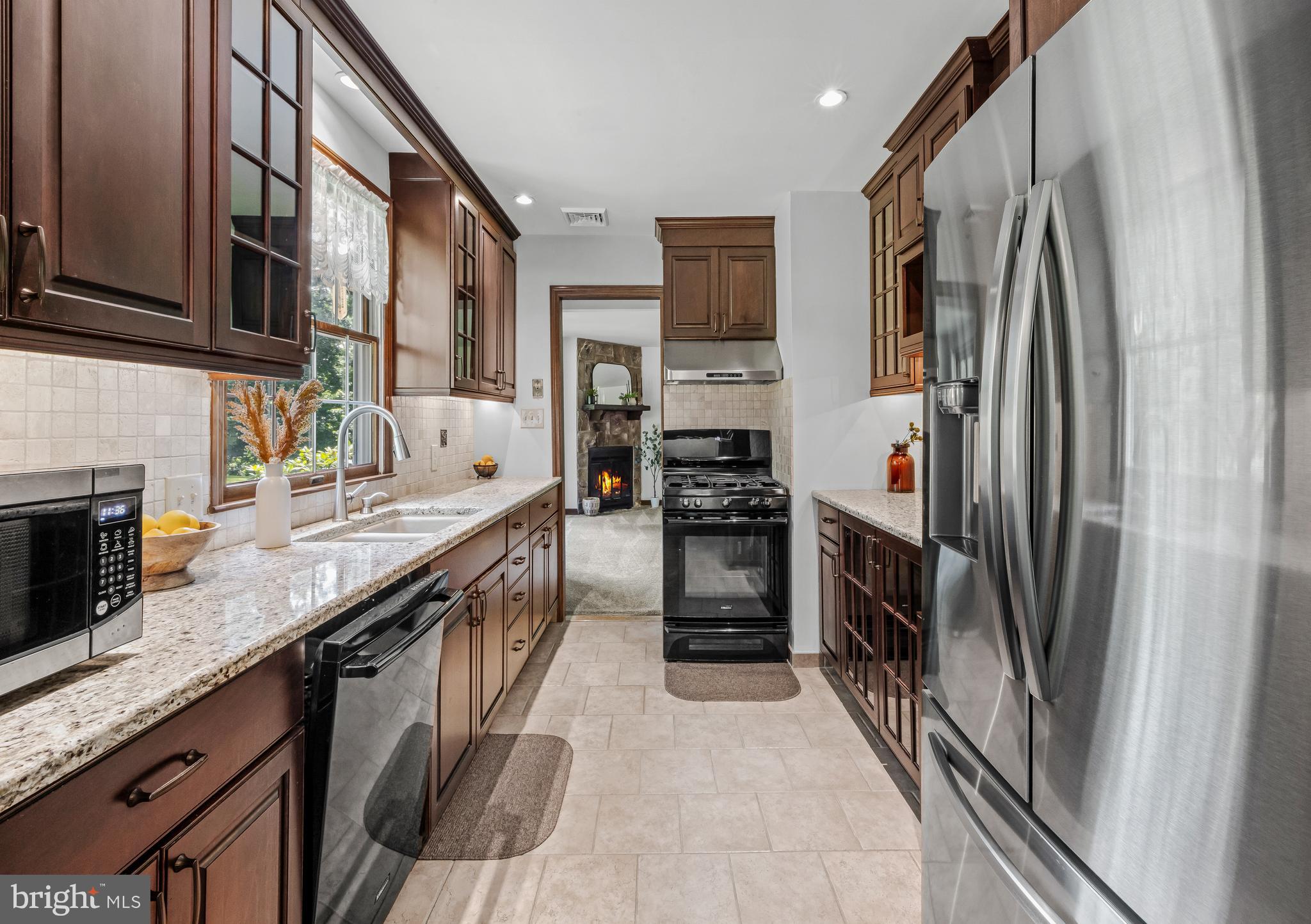 19 Miller Drive Sewell, NJ 08080 - Photo 10 of 20 a kitchen with stainless steel appliances granite countertop a refrigerator a stove and a sink