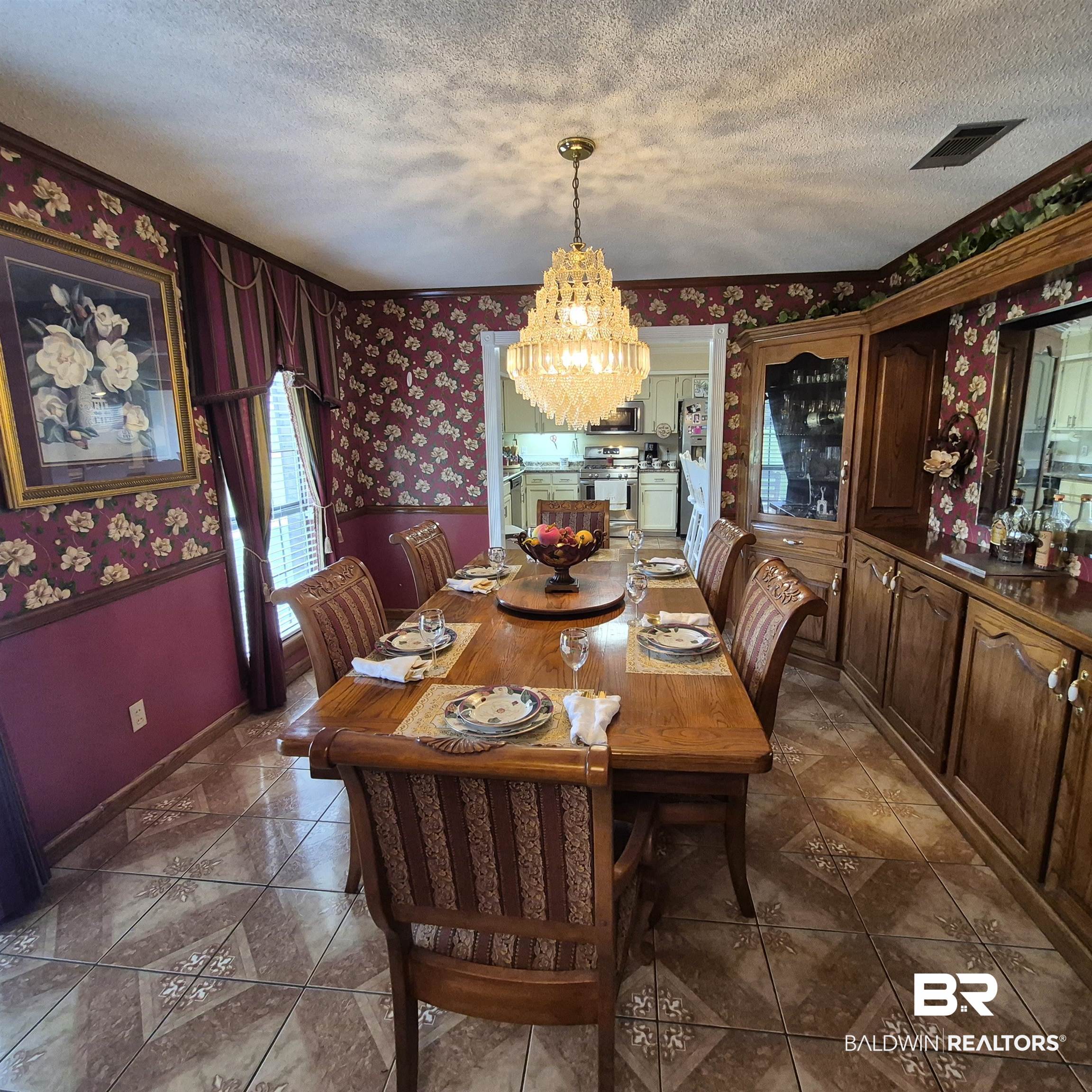 26635 Highway 41 Range, AL 36473 - Photo 17 of 74 Dining area with wallpapered walls, a chandelier, a textured ceiling, and dark tile patterned floors