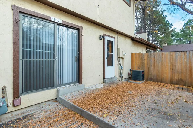 a view of backyard with tub and trees