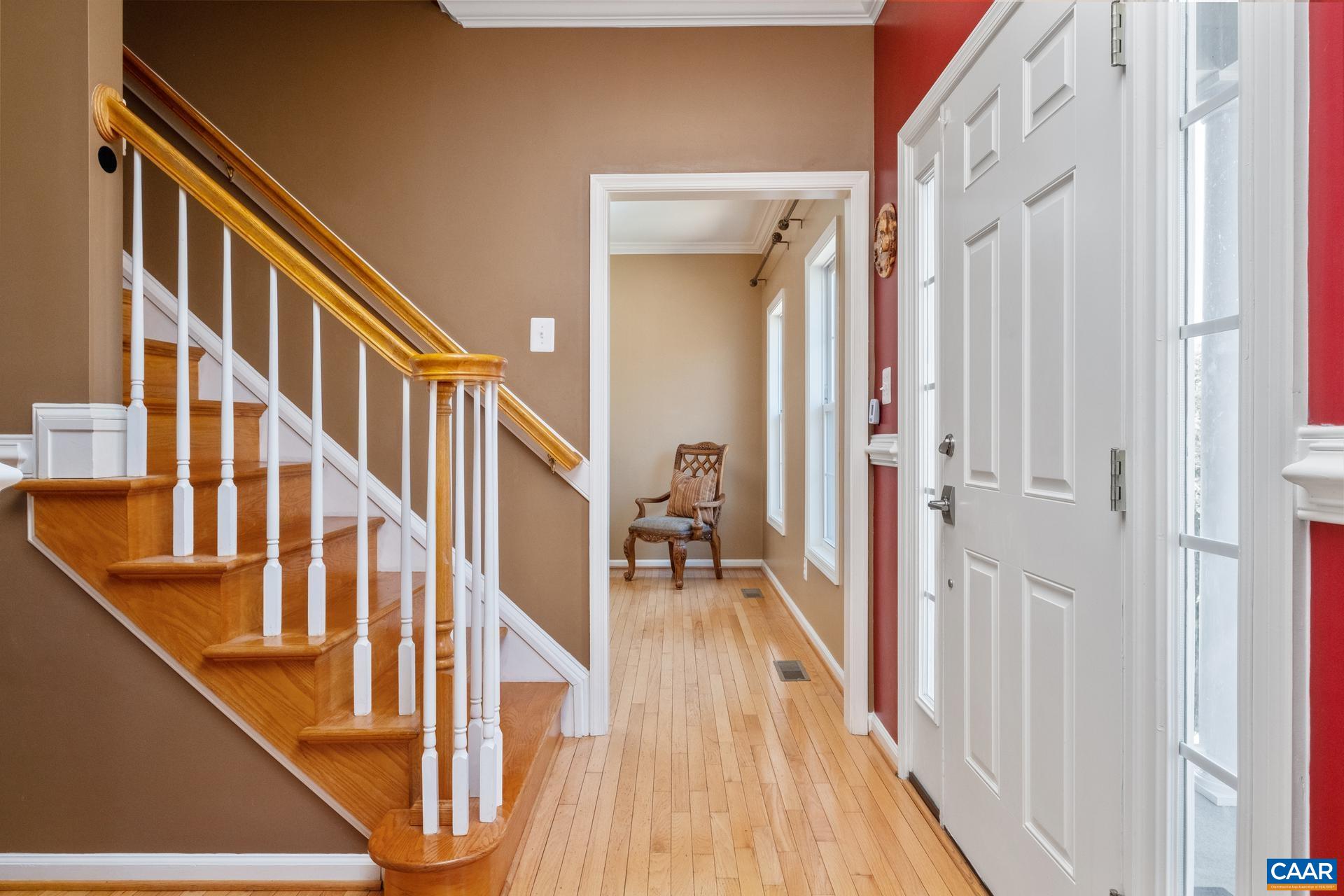 396 Riding Trail Lane Madison, VA 22727 - Photo 11 of 52 a view of a hallway with wooden floor and stairs
