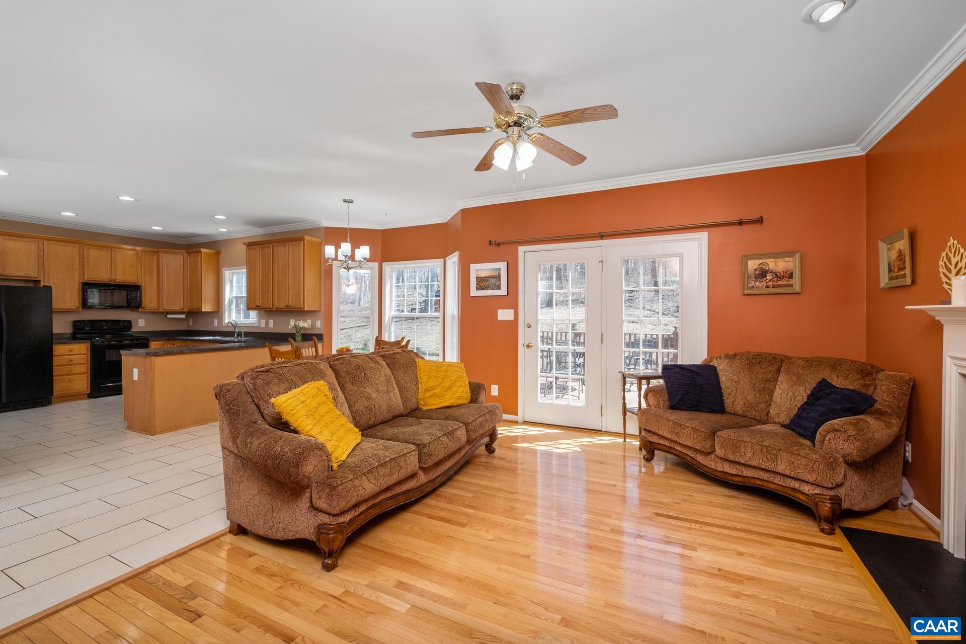 396 Riding Trail Lane Madison, VA 22727 - Photo 17 of 52 a living room with furniture kitchen area and a wooden floor
