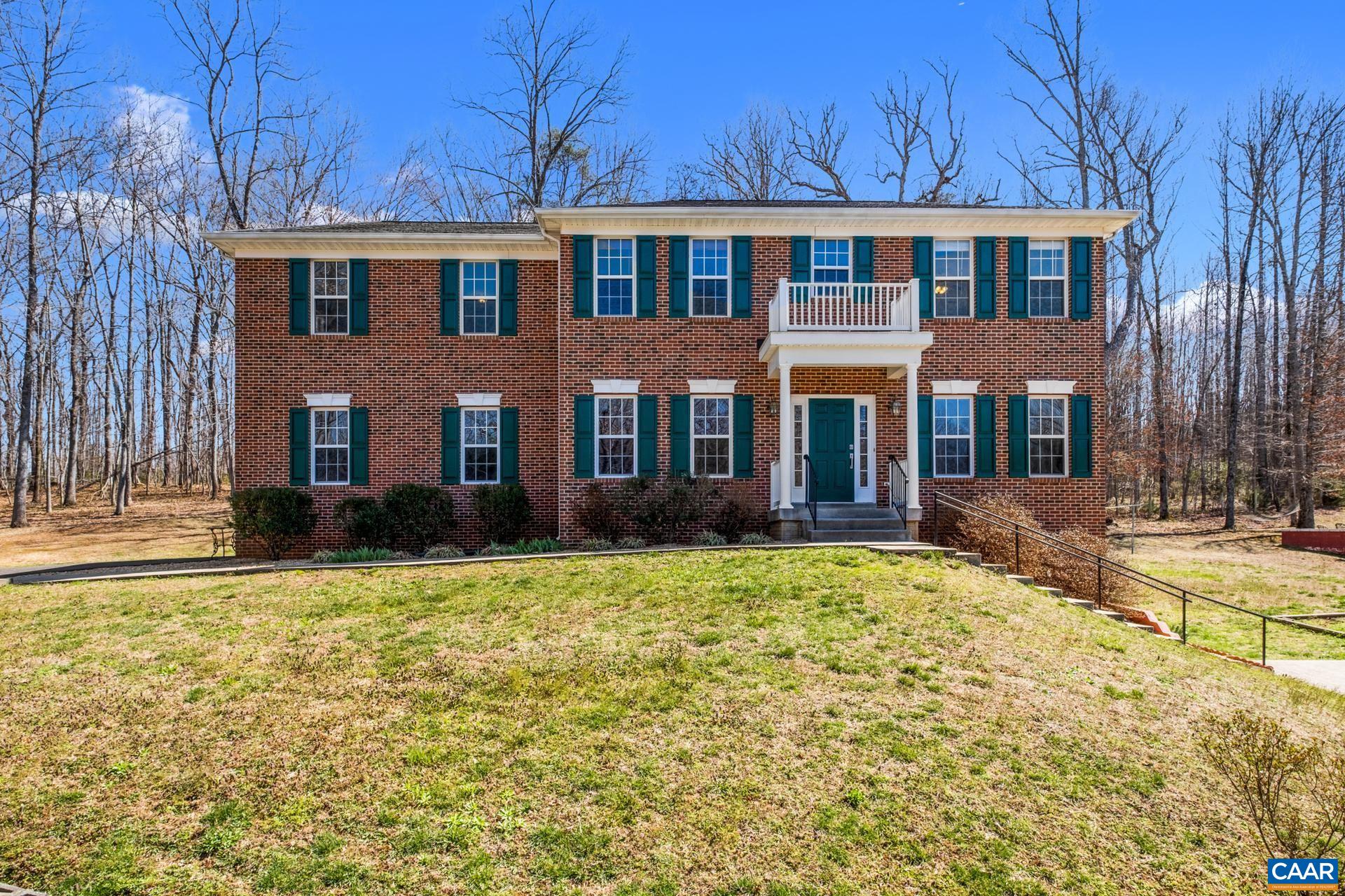 396 Riding Trail Lane Madison, VA 22727 - Photo 2 of 52 a front view of a house with a yard