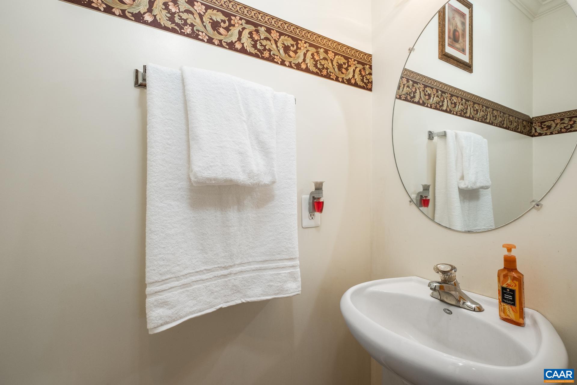 396 Riding Trail Lane Madison, VA 22727 - Photo 24 of 52 a bathroom with a sink and a mirror