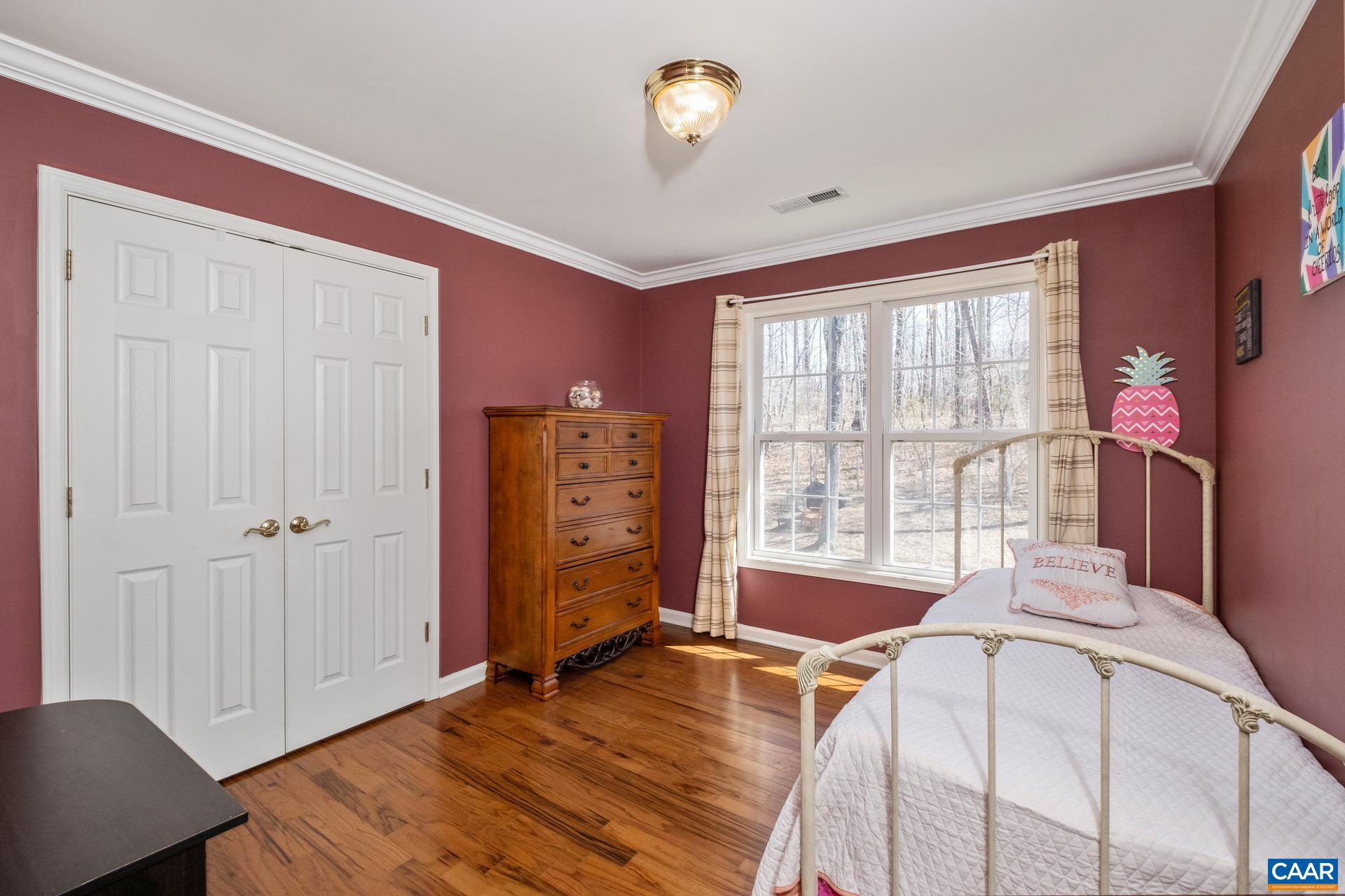 396 Riding Trail Lane Madison, VA 22727 - Photo 32 of 52 a bedroom with a bed and a window