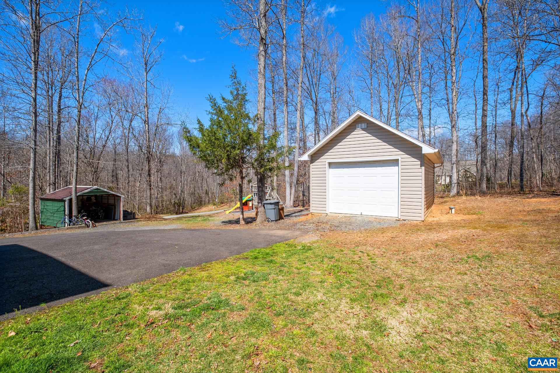 396 Riding Trail Lane Madison, VA 22727 - Photo 45 of 52 a front view of a house with a yard and garage