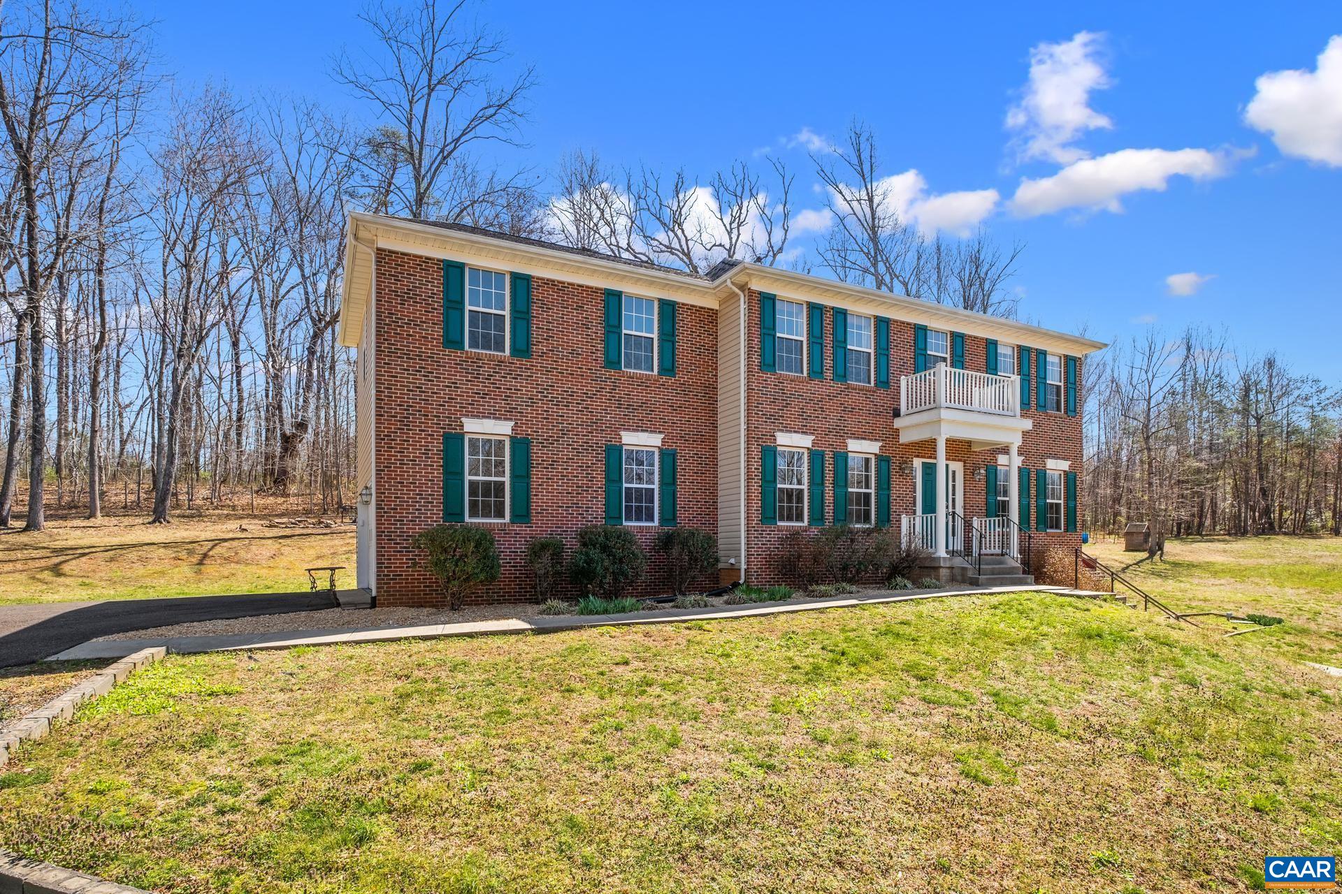 396 Riding Trail Lane Madison, VA 22727 - Photo 5 of 52 a front view of a house with a yard