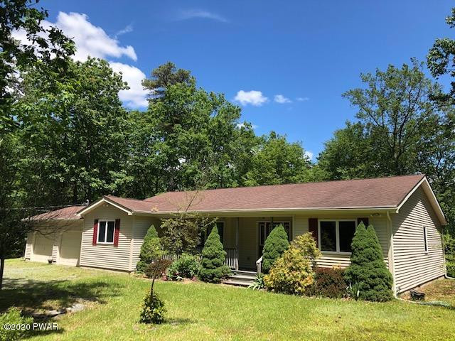 116 Maple Ridge Drive Hawley, PA 18428 - Photo 16 of 19 front view of a house with a yard