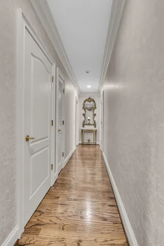 a view of gallery with wooden floor