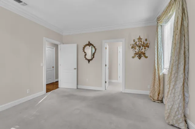 a view of a hallway with entryway door