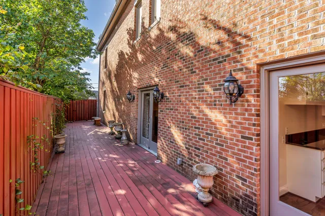 a view of a wooden door and a outdoor space