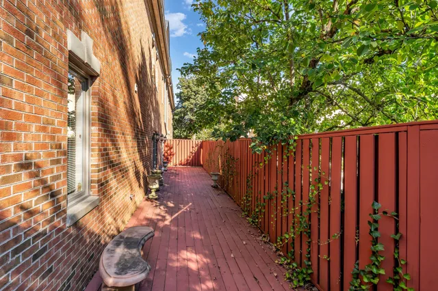 a view of outdoor space with wooden floor